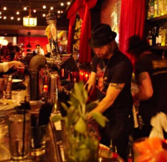 a bar tender making a drink